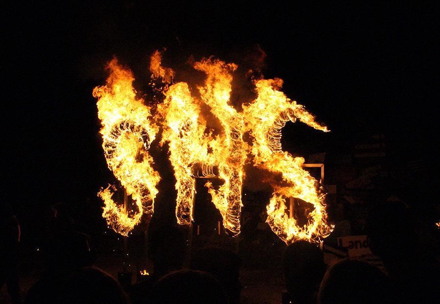 BLAZING LETTERS--A flaming SHS burns to start off the damp bonfire at Gaines County Park on Oct. 2.