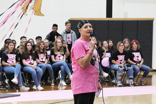 TESTIMONIAL
Math teacher Kimberlee Wilkins, a cancer survivor, speaks at the powder puff pep rally. She said the powder puff event helps cancer patients and their families, providing valuable support.