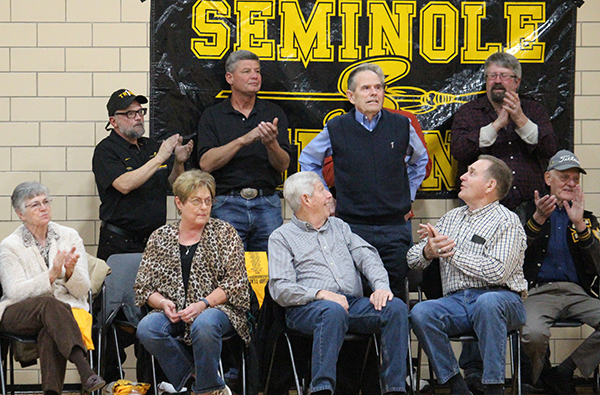 Living legacy--
Indians and their families from as far back as 1955 honor legendary Coach Buck Caffey at the Indians’ throwback game in the old junior high gym on Jan. 10. The games were held in the old gym because it was the gym the two state championship teams played in.
