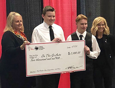 On-the-go dough--
Red Raider Start Up officials present sophomores Ervin Friesen and Davis Banman with prize money on Feb. 7 after winning the “Big Idea” business proposal contest.