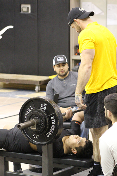 Region qualifer--
Indian Coach Call Barnard gets ready to spot junior Irvin Delgado in the bench press during the Big Spring meet on Jan. 11. Delgado qualified for regionals with a total wight of 1,240 pounds which put him in ninth position in the region.