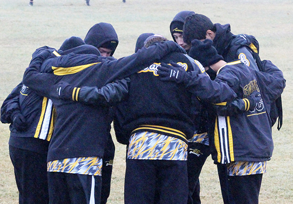 Praying for strength
The Indian team prays before beginning the district meet in frigid conditions in Andrews on Oct. 26. The team took second with 55 points, qualifying for the region meet.
