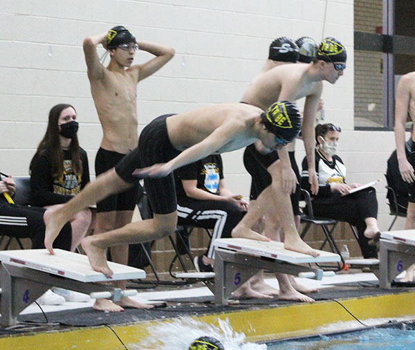 Double duty--
Junior Ian Ramirez and freshman Jacob Crothers begin the second leg of the men’s 200-meter freestyle relay in adjacent lanes at the home meet on Dec. 12. The relays took second and third. 