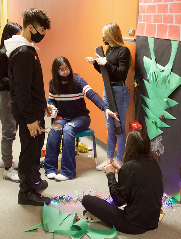 Decking the halls--
Juniors in Leanne Jones’s second period U.S. history class put their Grinch door together on Dec. 8. The student council sponsored the event with a Christmas song theme.