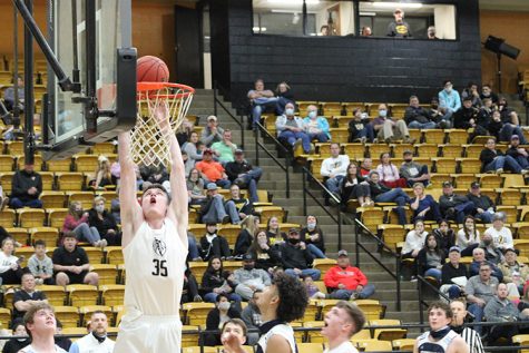 Putting it down--
Senior forward Blake Hamblin dunks the ball during the 76-45 win over Greenwood on Feb. 5. Hamblin had 11 points and 12 rebounds in the game.