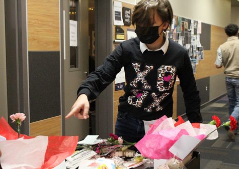 Making deliveries-- StuCo freshman Madison Fieler delivers Valentine o Grams to fourth period classes on Feb. 12. Price packages ranged from $1 to $10.