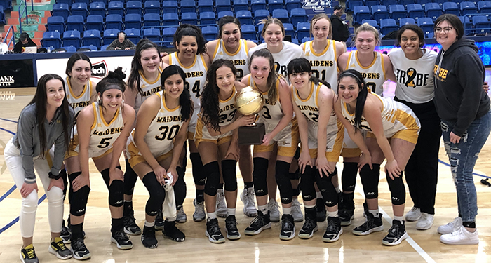Going to region tournament--
Maidens celebrate with the quarterfinal trophy after defeating Hereford, 61-53, on Feb. 19 in the Rip Griffin Center at Lubbock Christian University.