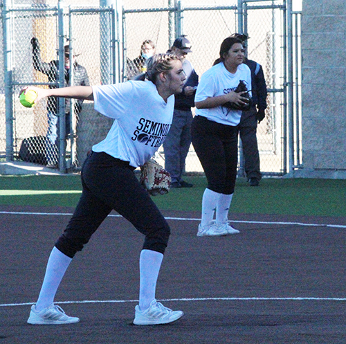 Back in the swing--
Senior pitcher Simone Roberson winds up for the throw while junior first baseman Natalie Deleon waits to field during the Feb. 9 scrimmage with Idalou. The Maidens will begin regular season play on Feb. 16 in Lamesa.
