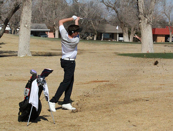 Letting it fly--
Junior Cason Johnson drives for the green during morning play at Andrews on March 6. Johnson took fourth individually while the team took second overall.
