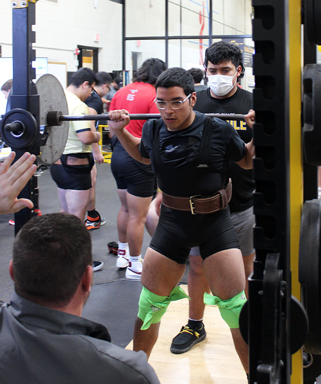 Veteran moves--Junior Jeremias Talamantes waits for the judges signal during squat competition on Jan 13. Talamantes was the only three-year lifter on the team as he took first in the 181-pound division with a total  of 1,000 pounds.