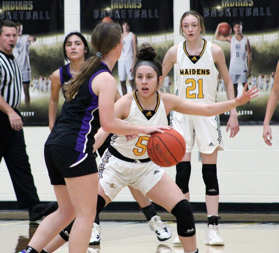 Not through here--Senior guard Xoe Rosalez protects the lane during district play with Pecos. Rosalez racked up 26 of the Maidens' 98 points against the Lady Eagles.