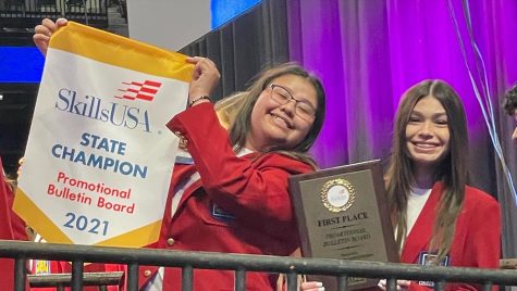 State champions--SkillsUSA Auto Tech seniors Luzelina Perez and Isyss Flores hold up the awards they and senior Dylan Klassen took for promotional bulletin board at state on April 3. The threesome took the gold at state, qualifying them for nationals in Atlanta in June.