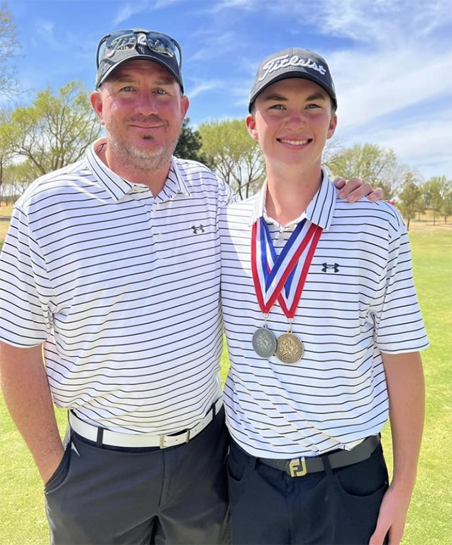 District+champ--Coach+Mitch+Shain+take+a+photo+with+district+golf+champion+senior+Cason+Johnson+at+Shadow+Hills+in+Lubbock+on+March+31.+Johnson+took+the+championship+shooting+145+strokes+over+the+two-day+tournament.