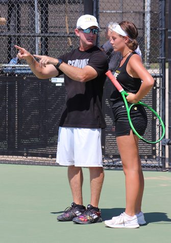 Giving pointers--Coach John Armstrong talks to sophomore Isabella Hare during a trip-match with Denver City and Pecos on August 27.