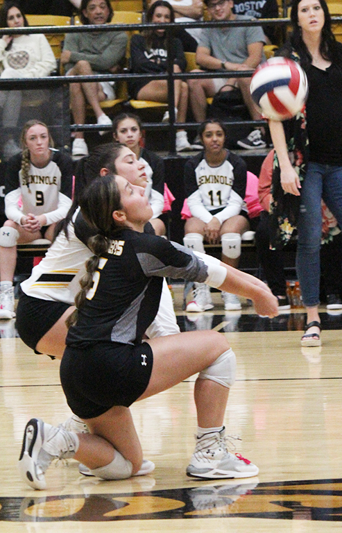 Can dig it--Senior libero Debahni Medina digs up an Andrews serve during district play on Oct. 15. The Maidens would go to five sets versus the Lady Mustangs but eventually get the win.