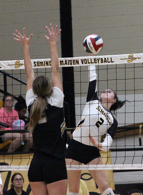 Take that--Sophomore setter Londyn Shain goes on the attack against Andrews on Oct. 15. The match would go to five sets, but the Maidens took the win.