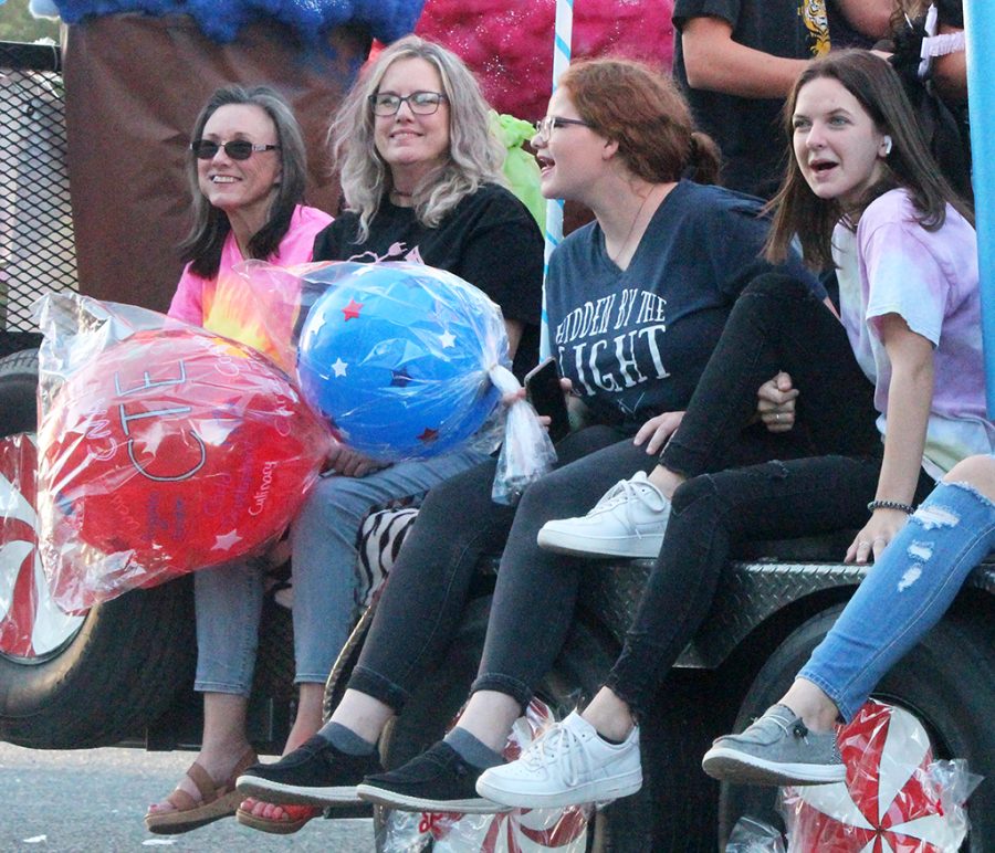 Ride for pride--
Family consumer sciences teacher Jill Darby, cosmetology teacher Dar Lynda Davis, junior Chloe Garrison and sophomore Elizabeth Bear ride the career and technology education float on Sept. 30. The theme was Home, Sweet Homecoming.