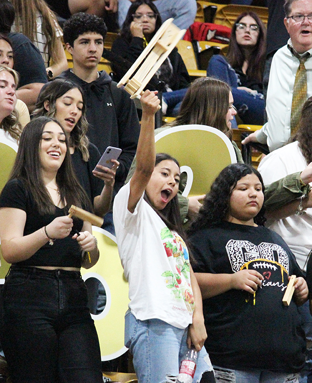 Make some noise--
Junior Bianette Nava raises her noisemaker above her head during the homecoming pep rally on Sept. 30 as she and classmates Natalia Aguilera and Esveydi Reyes watch the festivities