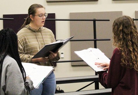 Getting ready--senior Olivia Rempel, junior Angie Klassen Enns and sophomore Lliani Lopez practice area choir music during A Cappella on Nov. 10. Klassen Enns would take first chair in the alto section.