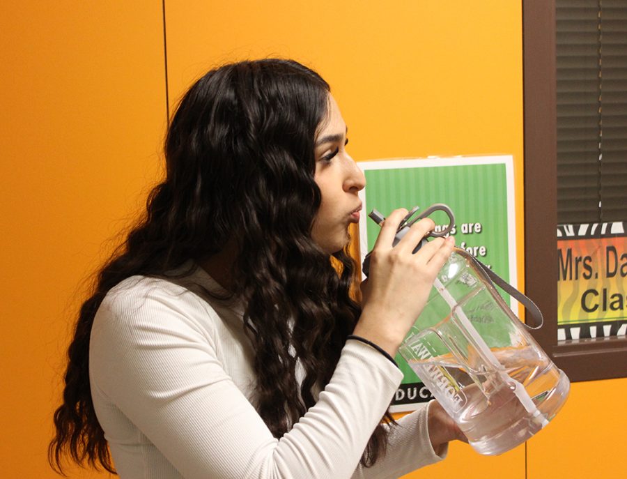 Water resolve--
Senior Genesis Valdez takes a drink from her new jug in fourth period medical terminology. She got the jug for the new semester because “Drinking water makes me feel better, healthier and stronger,” Valdez said. 