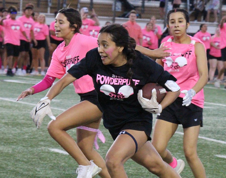Run, run, run--Junior Bianette Nava takes the ball down field during the first quarter of the powder puff game on Oct. 20.