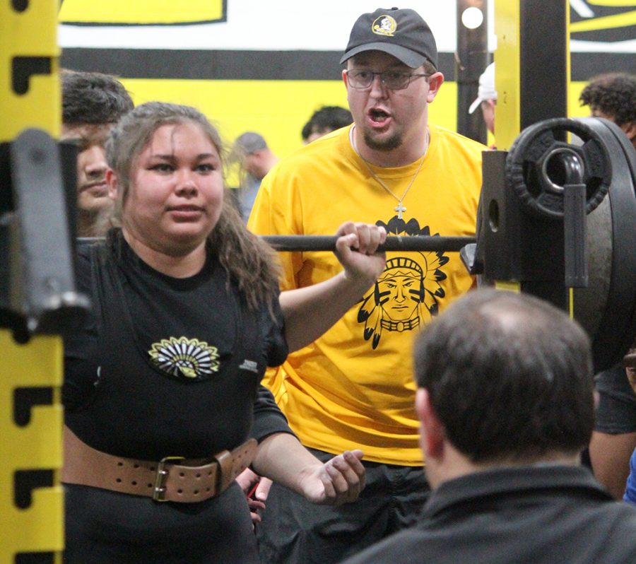 Getting+the+win--Coach+Will+McCallister+offers+encouragement+as+junior+Alexia+Gonzales+dead+lifts+335+pounds+during+the+home+meet+on+Feb.+2.+Gonzales+lifted+895+pounds+over+three+events+to+win+first+place+at+the+meet.