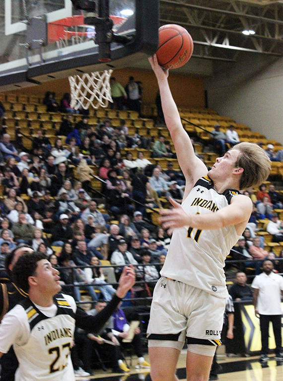 Lay it in--Senior guard Wyatt Holmstrom fills the basket during district play with Pecos on Jan. 23. Holmstrom scored 10 points in the 80-24 Indian win.