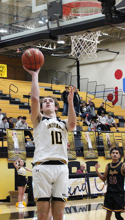 Up for two--Sophomore forward Caron Cramer shoots a layup during district play with Pecos on Jan. 23. Cramer had five points during the Indian win.