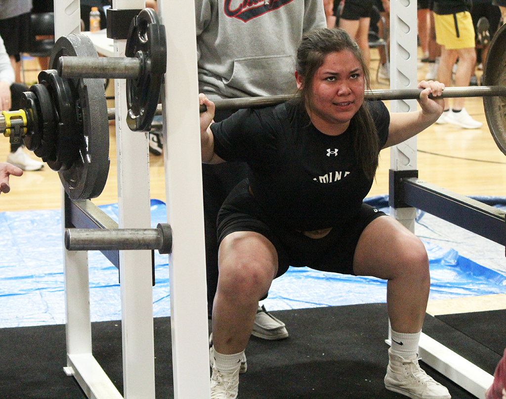 Dominate--
Senior Alexia Gonzales squats  310 pounds at the home meet on Feb. 1. Gonzales took first overall in the 198-pound class, lifting a total of 810 pounds