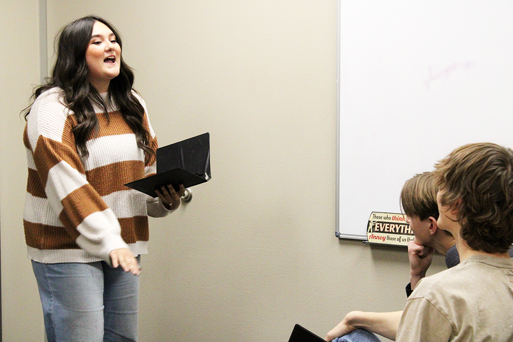 Practice, practice--Speech senior Aubrey Brown performs her piece for teammates in November before a TFA qualifier. This is Browns third year to qualify for state with a sixth place finish in 2022.