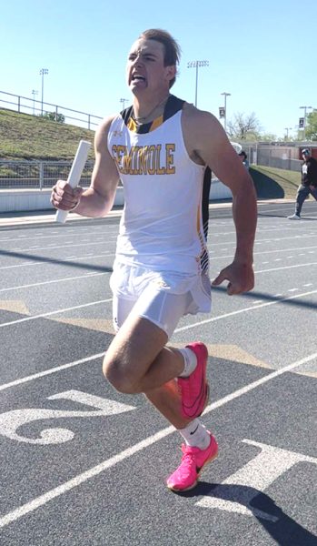 Fast leggin--Sophomore Caton Cramer runs his leg of the 1600-meter relay during the area meet in Andrews on April 11. Cramer, along with seniors Zack Smith, Eduardo Rodarte and Daniel Lapusan squeaked into regional qualification in fourth place by beating Canyon by .45 of a second.