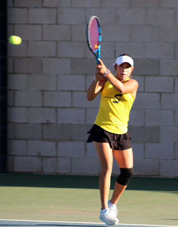 Backhand ball--Junior Melany Vazquez Campos returns fire to Lubbock Cooper Liberty's Ava Smith during district singles on Oct. 1. Vazquez Campos took the match, 6-1, 6-0.