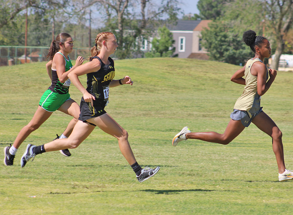 And they’re off--
Sophomore Addison Armstrong sprints from the start line during Monday’s district race in Andrews. Armstrong would take second overall, qualifying individually for regionals, and leading her team to a regional berth.