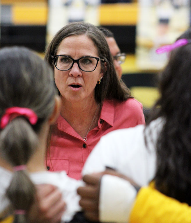 Strategy session--
Coach Amanda Kirkpatrick talks to her Maiden team during a time out in district play on Oct. 1. “Positivity is a skill that makes a good coach,” Kirkpatrick said. “I think that plays a huge part in being a coach.”