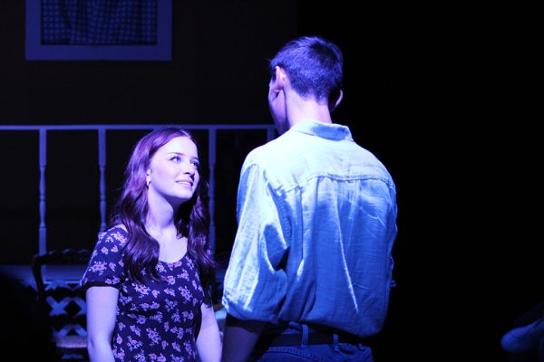 Falling in love--
Drifter Hal Carter, portrayed by senior Matthew Peters, looks into the eyes of local girl Madge Owens, played by junior Violet Barkis Robertson, in a scene from the theater department’s production of Picnic on Nov. 17. The department put on four consecutive performances from Nov. 15-18.