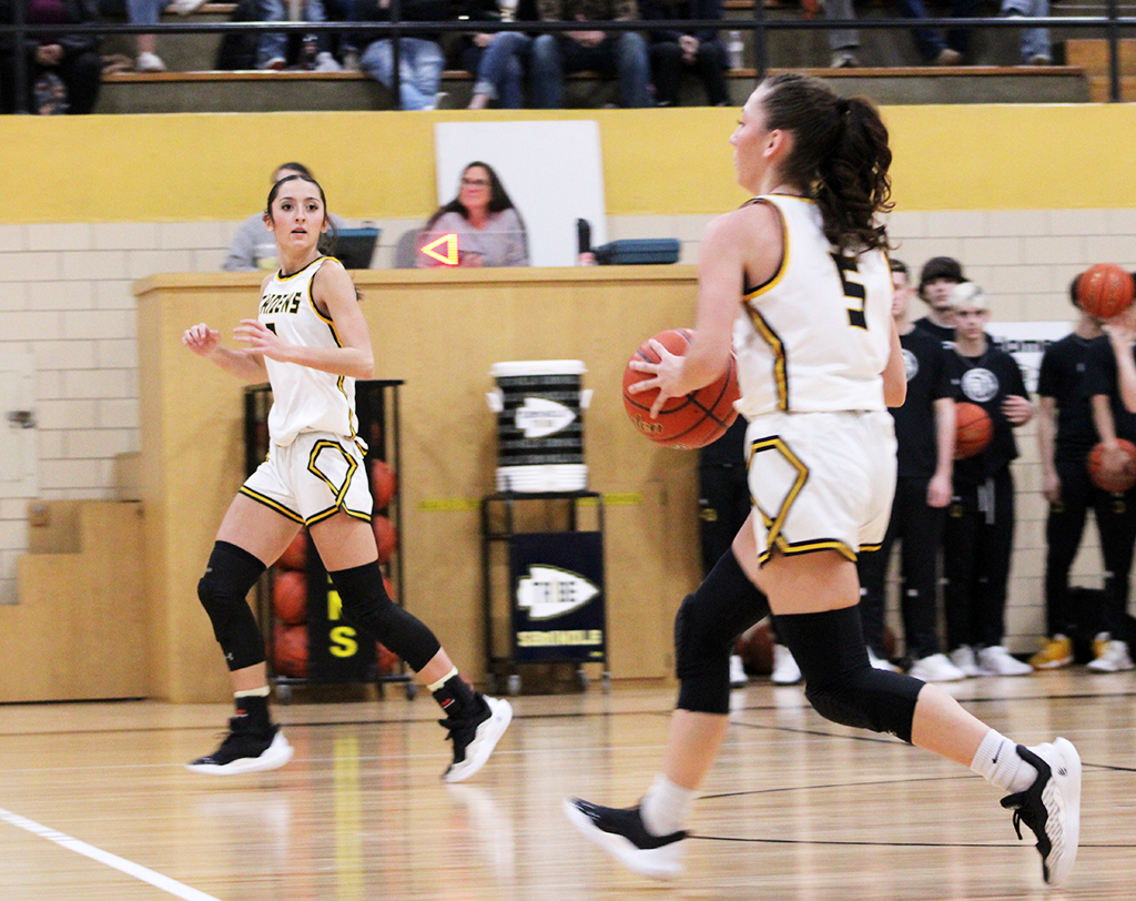 Team work--
Junior guard Jordan Danley makes the pass to her sister sophomore guard Rylee Danley  for one of Rylee’s nine three pointers in the Monahans game on Jan. 31 in the old junior high. Jordan nine assists during the Maiden victory.