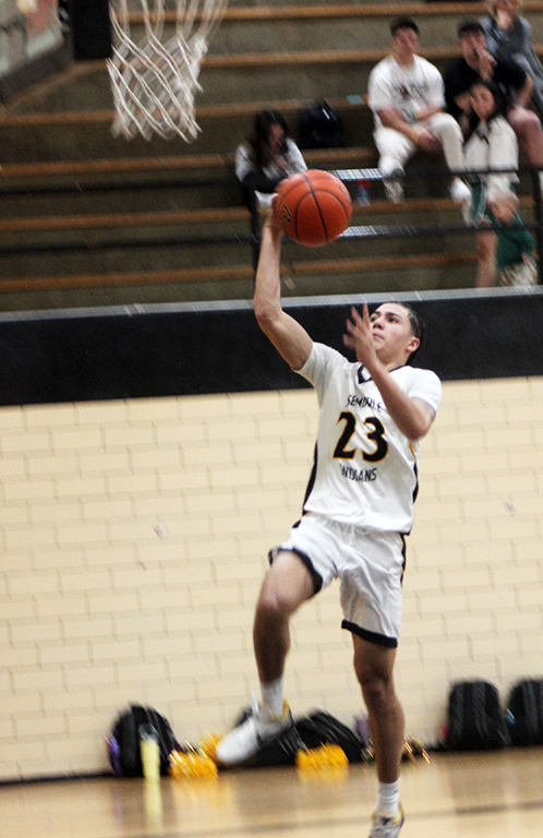 He’s a thief--
Capitalizing on a Lobo mistake, junior guard Jordan Garcia takes the ball he just stole in for a lay up on Jan. 31. Garcia had eight steals in the Indian win over Monahans.