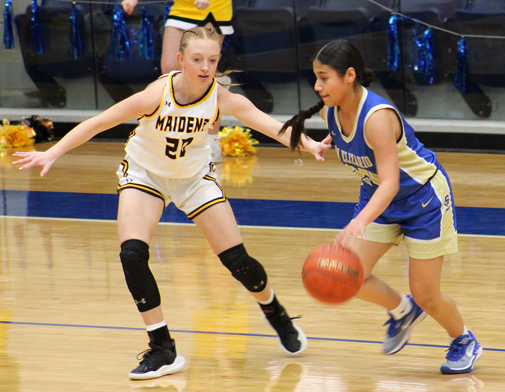 Like glue--Sophomore guard Addison Armstrong guards San Alizarin's Jazlyn Hernandez during area play on Feb. 13. Armstrong had eight points in the Maiden victory.