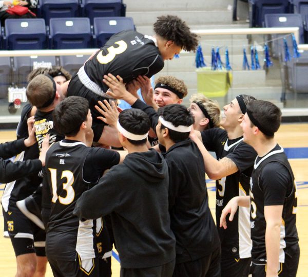 Man of the moment--Indians elevate sophomore guard Tristan Flemons at midcourt after the 45-40 win over San Elizario on Feb. 21. Flemons had 14 points in the Indian win.