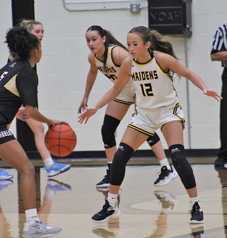 Not through here--Sophomore guard Miley Bates guards an Andrews player during the home match up on Jan. 28. District coaches chose Bates as defensive player of the year.