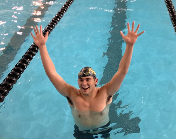 Cloud nine--
Junior Gabryl Alaniz celebrates after qualifying outright for state in second place in the 100-yard butterfly at the region meet in Andrews on Feb. 1. Alaniz toppled a 40-year school record in the process.