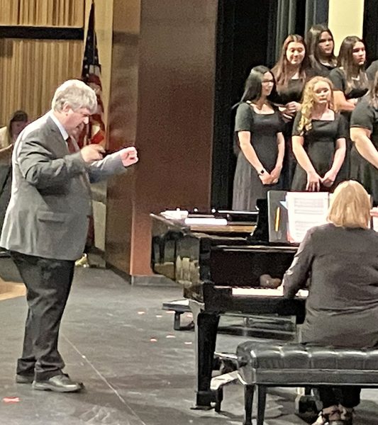 Last pre-UIL concert--Choir Director Eric Hindman directs the men's chorus portion of the pre-UIL concert on March 3. Hindman will retire in June after 36 years presiding over Seminole choirs.