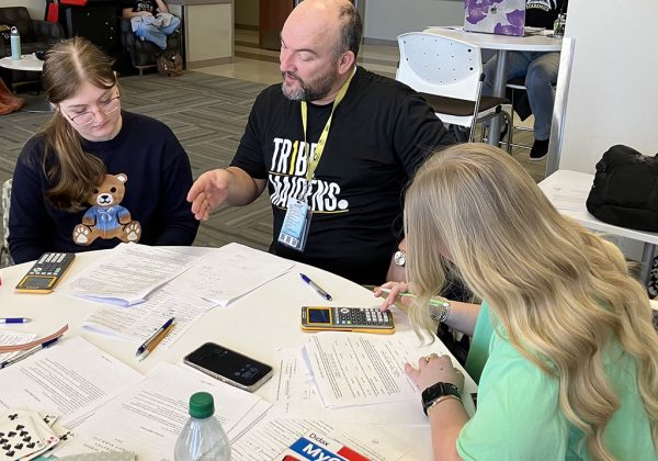 Few more things--UIL math Coach Anthony Newberry works with Junior Eva Thiessen and senior Olivia Hicks before competition at the Texas Tech meet on March 1.