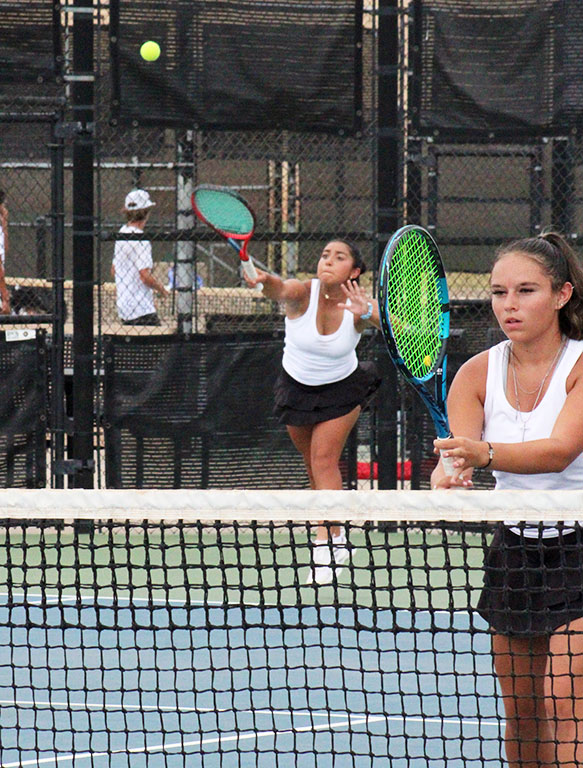 On the offensive--
Junior Tori Barrientos serves to Shallowater on Sept. 13, while her partner, senior Ivy Flores waits to return. The duo took the match, 6-1, 6-0, over the Mustangs’ Kendall Arney and Azariah Marquez, as one of 11 wins in the competition.