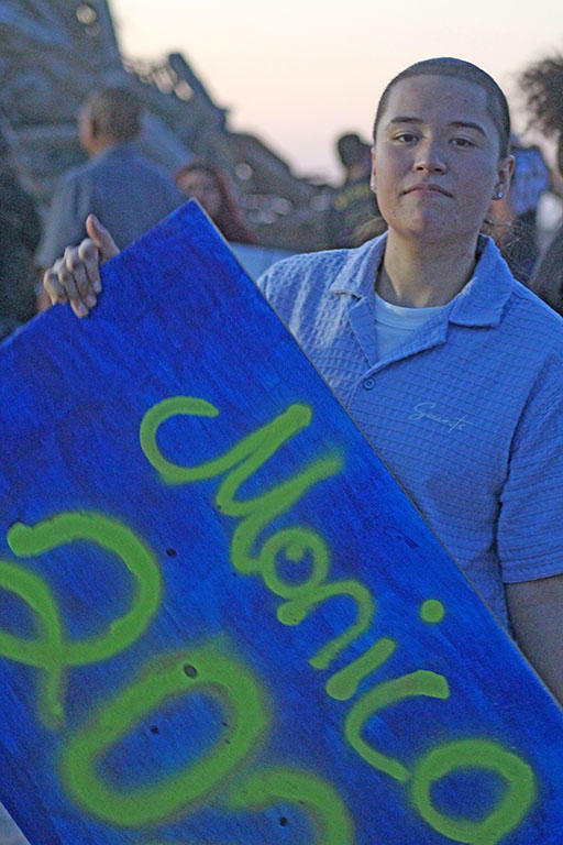 Senior sign--Senior Monica Miranda poses with her senior sign at the bonfire on Sept. 11.
