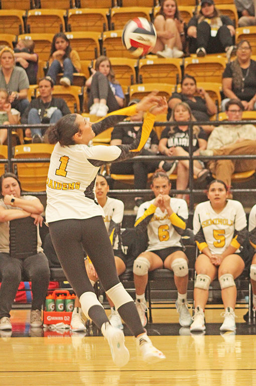 Put it down!--
Senior hitter Brittany Wimmer goes up for an attack during district play on Tuesday. Wimmer had a handful of kills in the first set alone as the Maidens moved to 1-0 in district.
