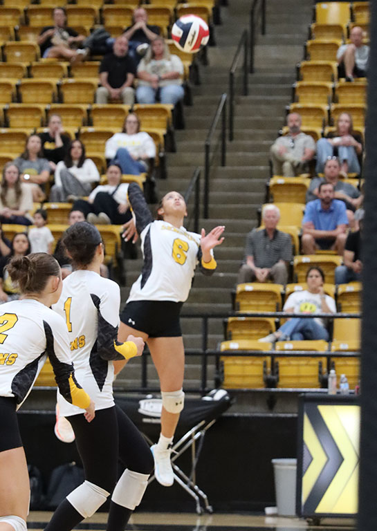Put it down!--
Senior hitter Brittany Wimmer goes up for an attack during district play on Tuesday. Wimmer had a handful of kills in the first set alone as the Maidens moved to 1-0 in district.