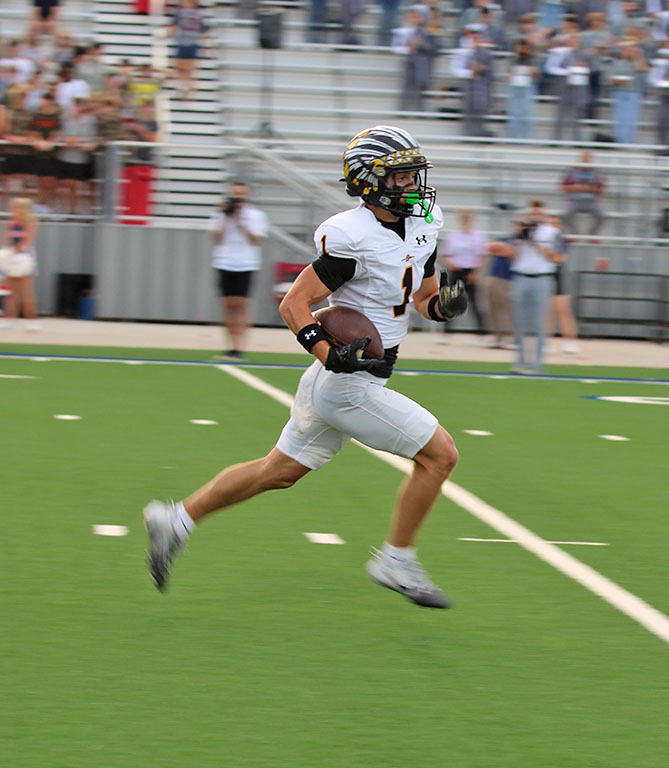 Scamper for six--
Senior receiver Logan McCormick runs in a reception for a touchdown during preseason play at Liberty on Sept. 19. McCormick had two of the Indians’ four touchdowns.