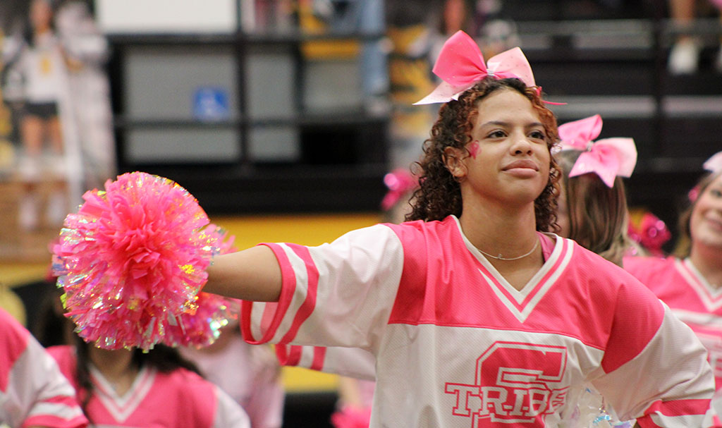 Pink performance--Senior cheerleader Brittany Wimmer moves to a cheer during the pink-out pep rally on Oct. 10. 