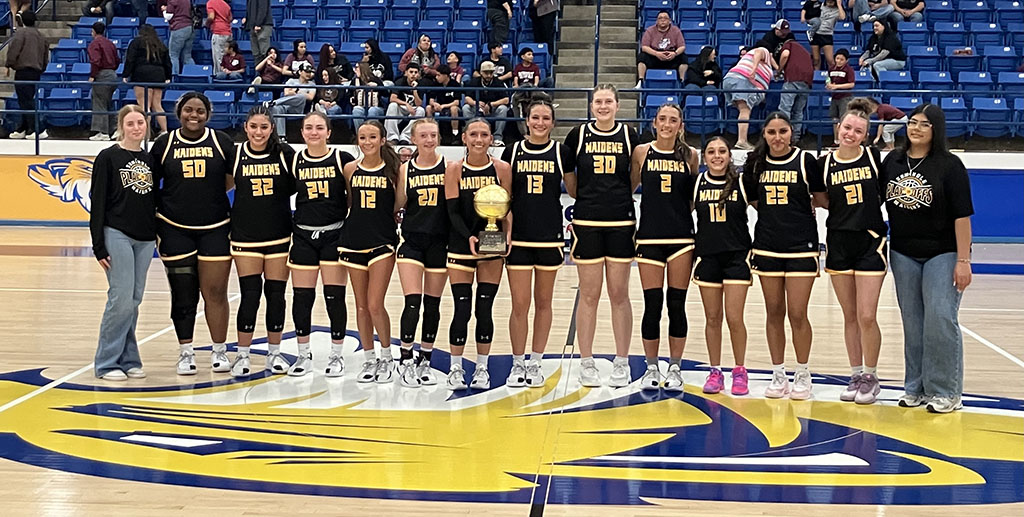 Bi-district champs--The Maiden basketball team poses with the bi-district trophy after defeating Hereford, 52-35, on February. 16.